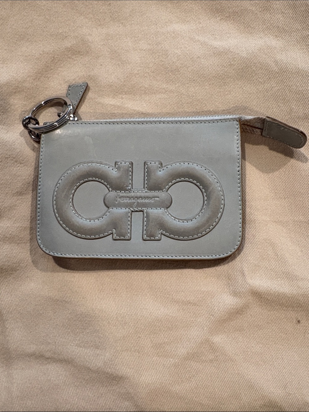 Salvatore Ferragamo light gray leather pouch with embossed logo keychain/coin